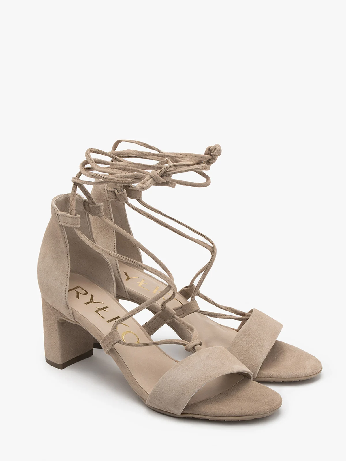 Beżowe sandały z ozdobnym wiązaniem wokół kostki