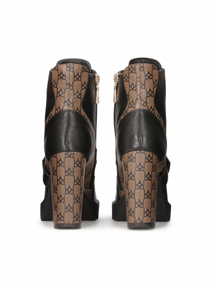 Wzorzyste skórzane botki na wysokim słupku i grubej podeszwie