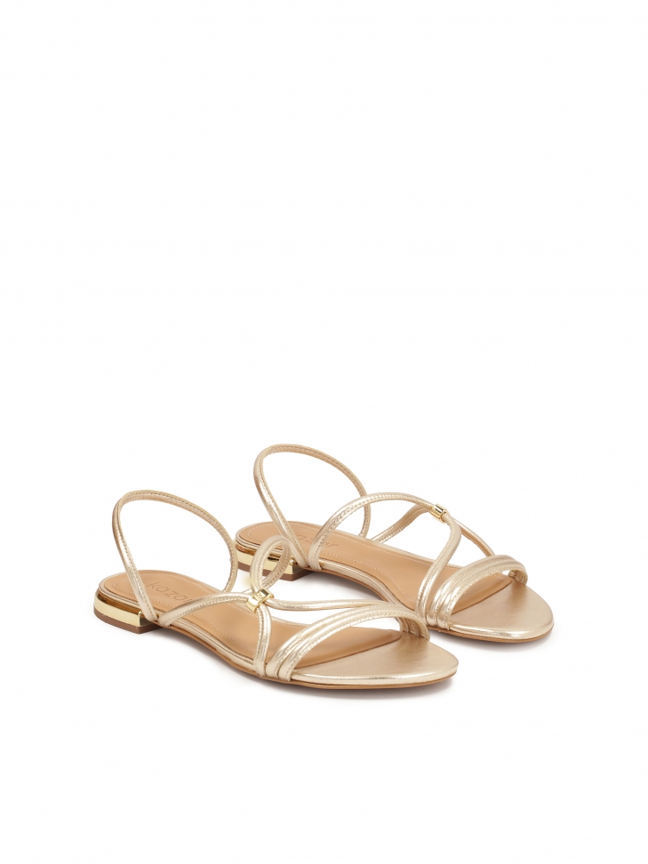 Złote klapki z możliwością noszenia jako sandały