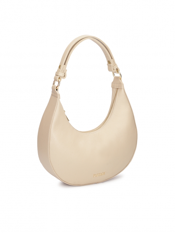 Beżowa torebka ze skóry o unikatowym kształcie