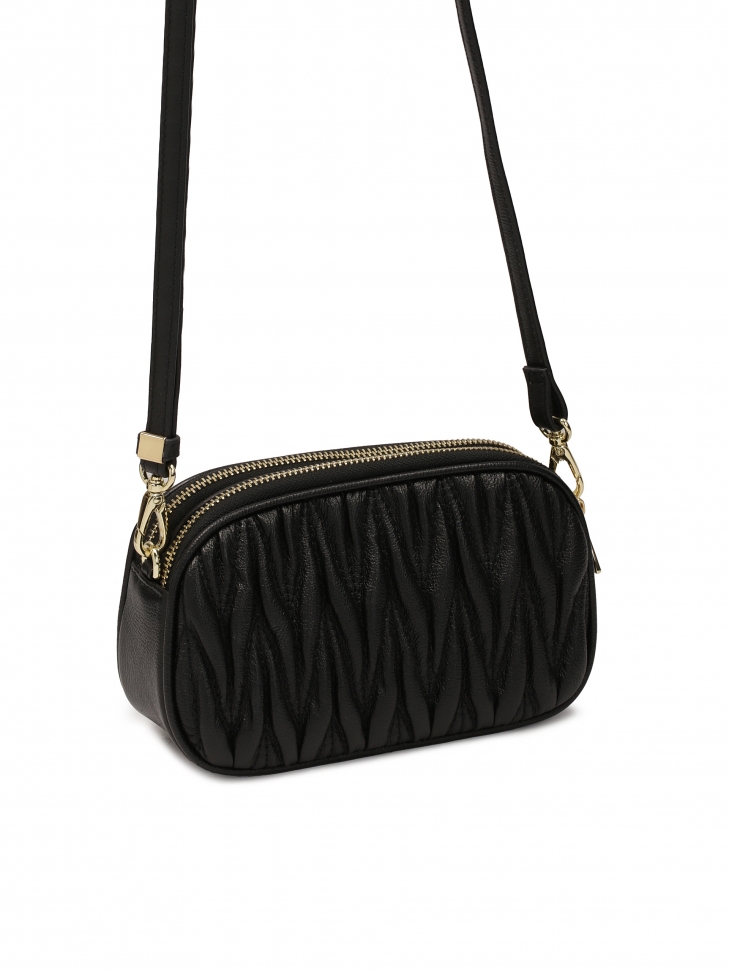 Pikowana mała torebka z regulowanym paskiem