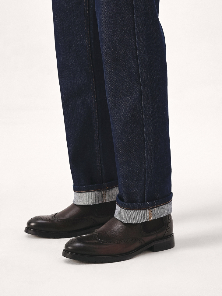 Brązowe skórzane sztyblety z rozetowym zdobieniem