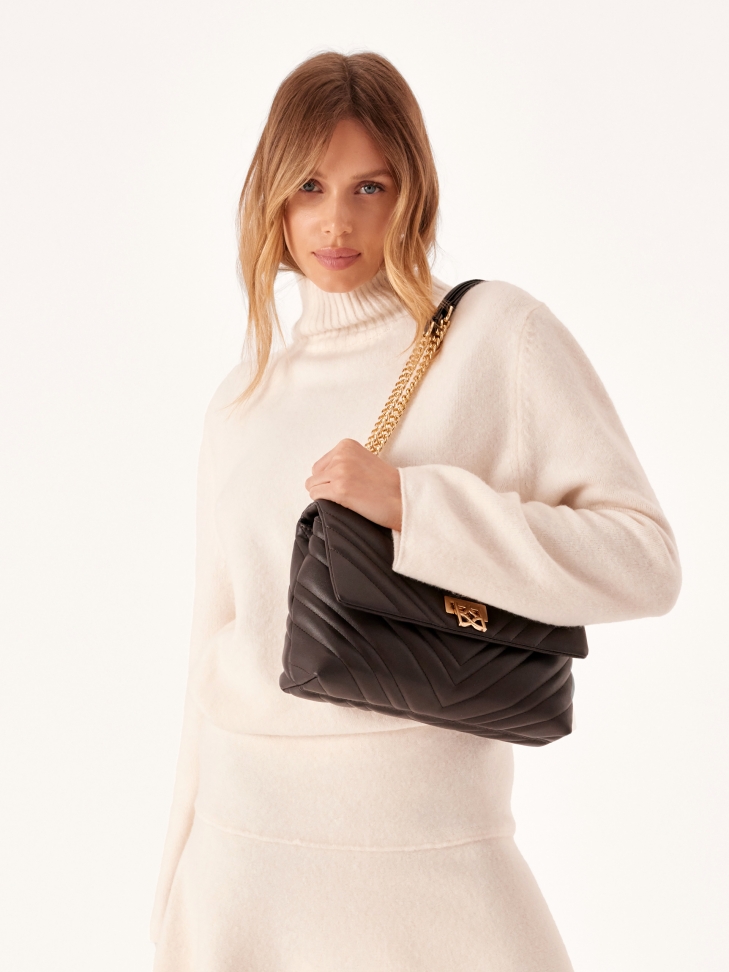 Kompaktowa torebka na ramię z modnym pikowaniem