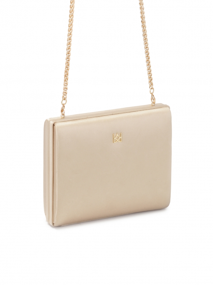 Sztywna torebka poyta beżową tkaniną