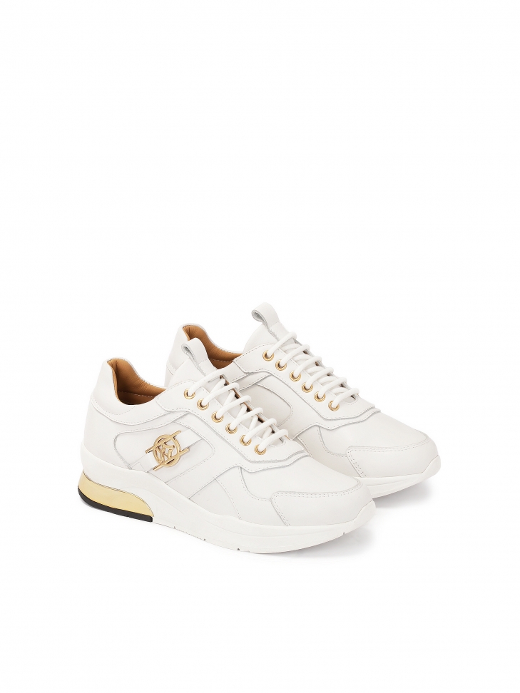 Białe skórzane sneakersy ze otą wstawką