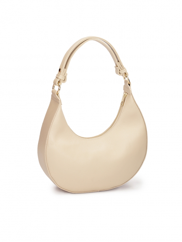 Beżowa torebka ze skóry o unikatowym kształcie