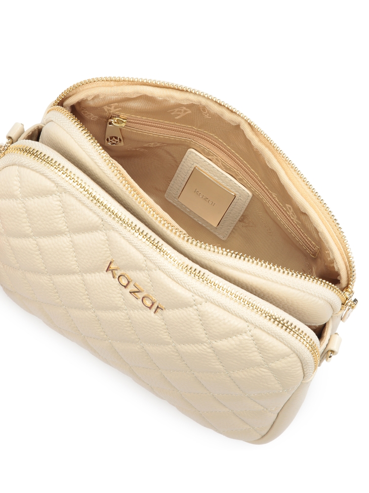 Skórzana torebka na pasku zdobiona pikowaniem