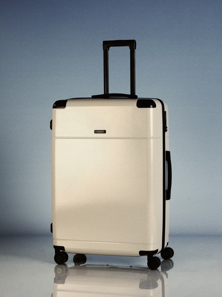 Duża beżowa walizka PC na zwrotnych kółkach