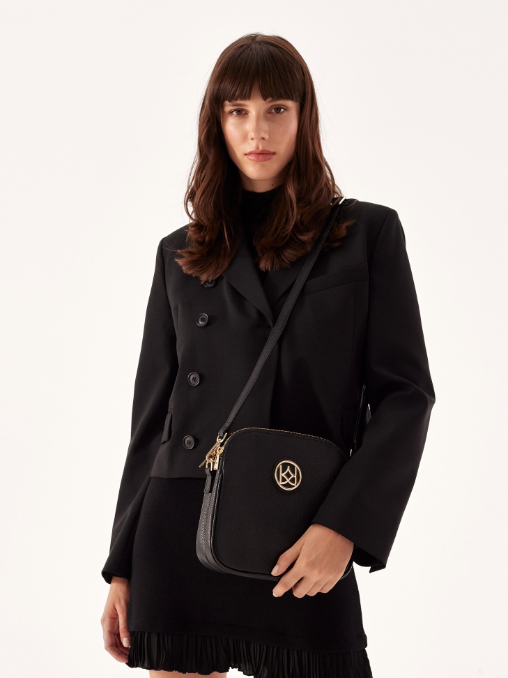 Skórzana torebka listonoszka z monogramem