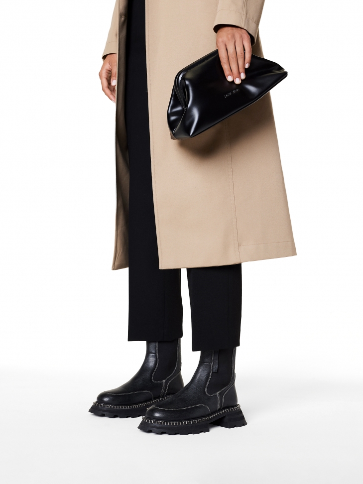 Czarne skórzane botki typu chelsea z kontrastowym obszyciem