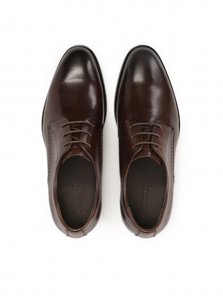 Brązowe półbuty z otwartą przyszwą i ażurowym zdobieniem