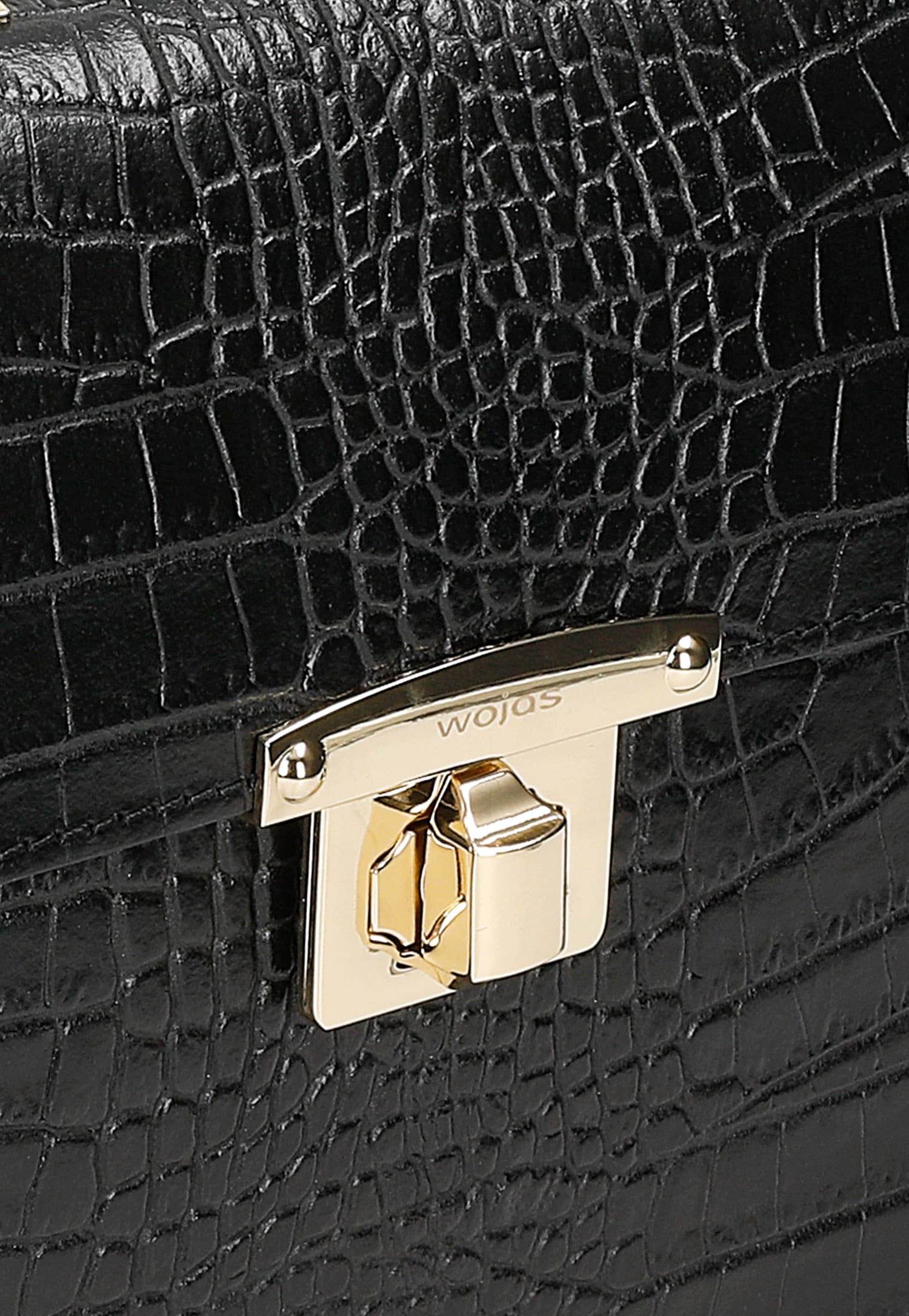 Czarny elegancki kuferek ze złotymi akcentami