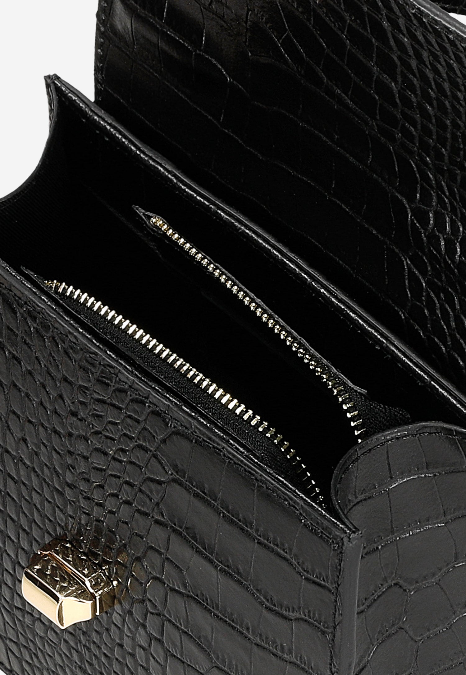 Czarny elegancki kuferek ze złotymi akcentami