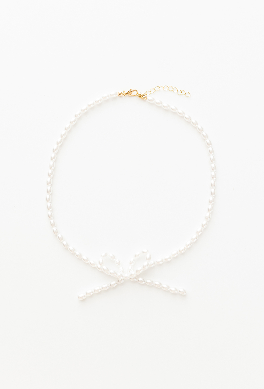 Naszyjnik z perełek z kokardką – biżuteria dla dziewczynki