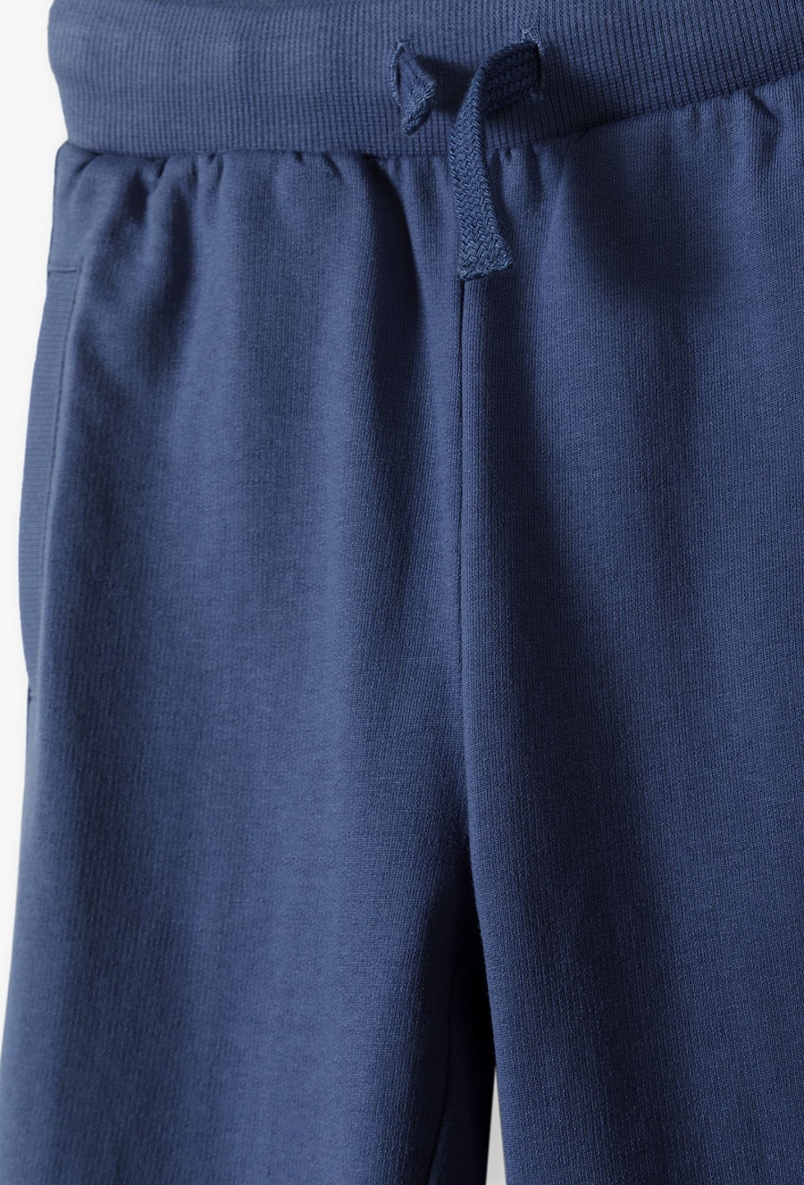 Spodnie dresowe dla chłopca - niebieskie z kieszeniami
