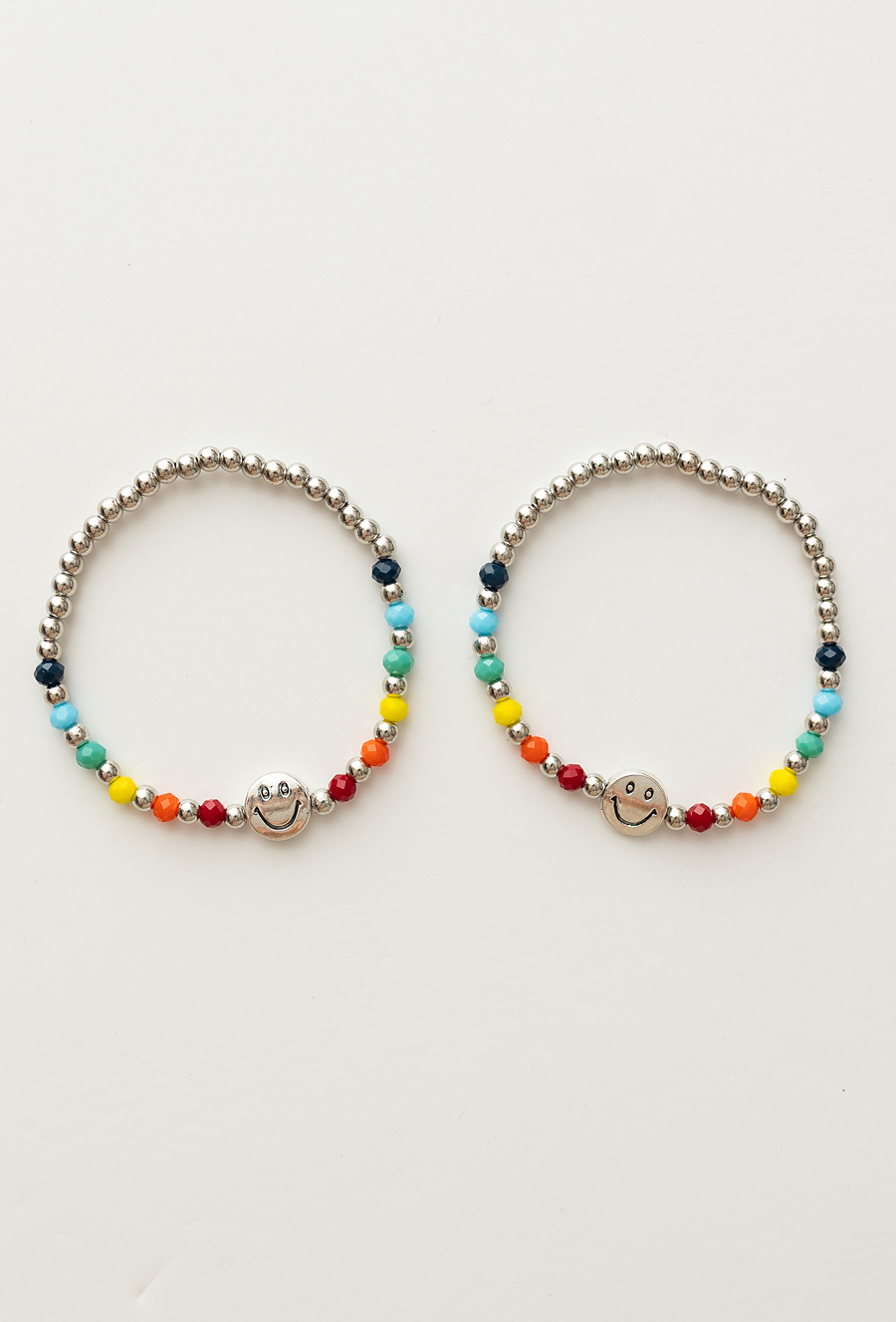 Zestaw bransoletek z kolorowych koralików z buźką – 2 szt