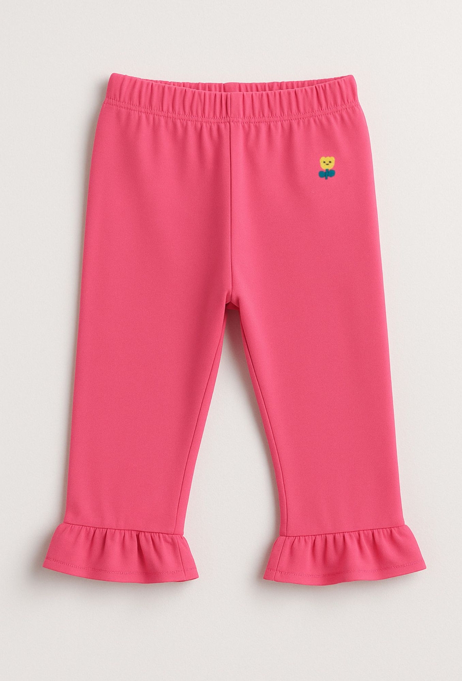 Różowe spodnie wide leg z falbanką i haftem