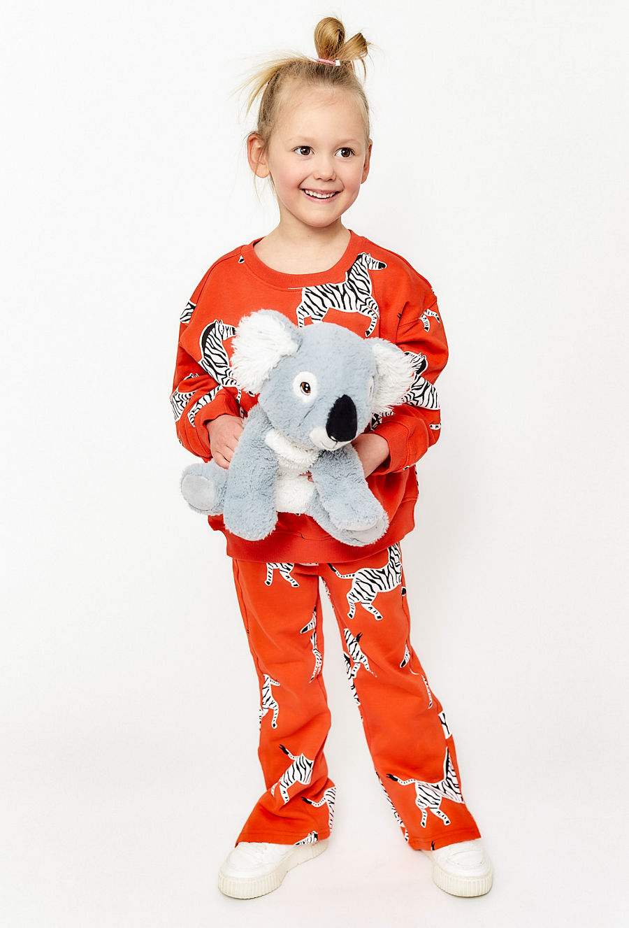 Spodnie dzianinowe dla dziewczynki - flare czerwone w zebry