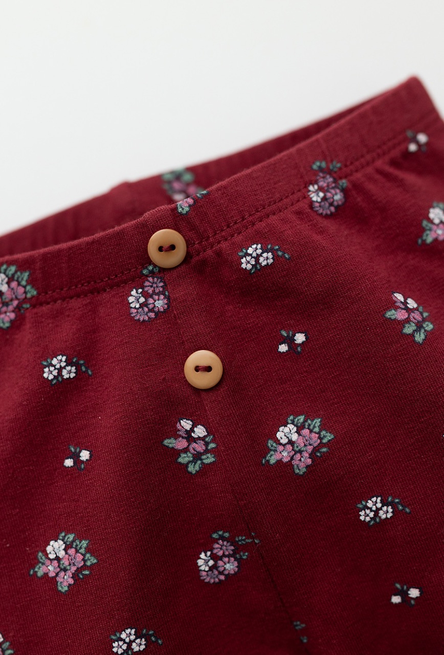 Czerwone legginsy niemowlęce w kwiatuszki z bawełny