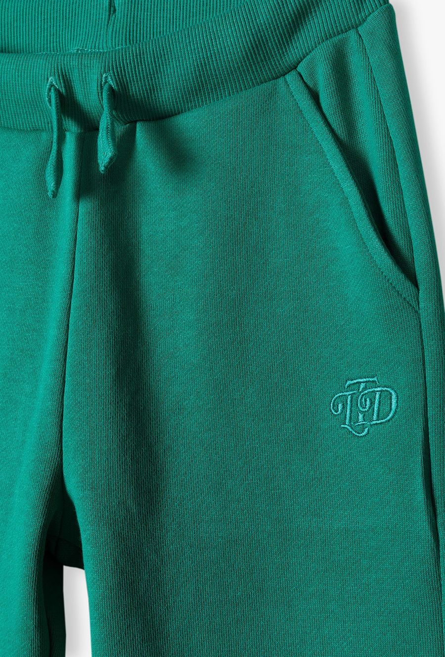 Zielone spodnie dresowe dla małego chłopca