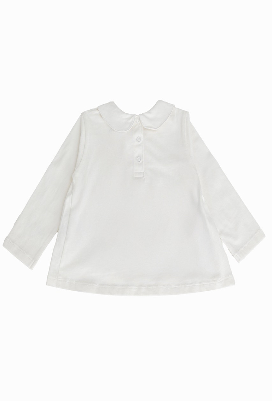 Biała bluzka dziewczęca z haftowanym kołnierzykiem.