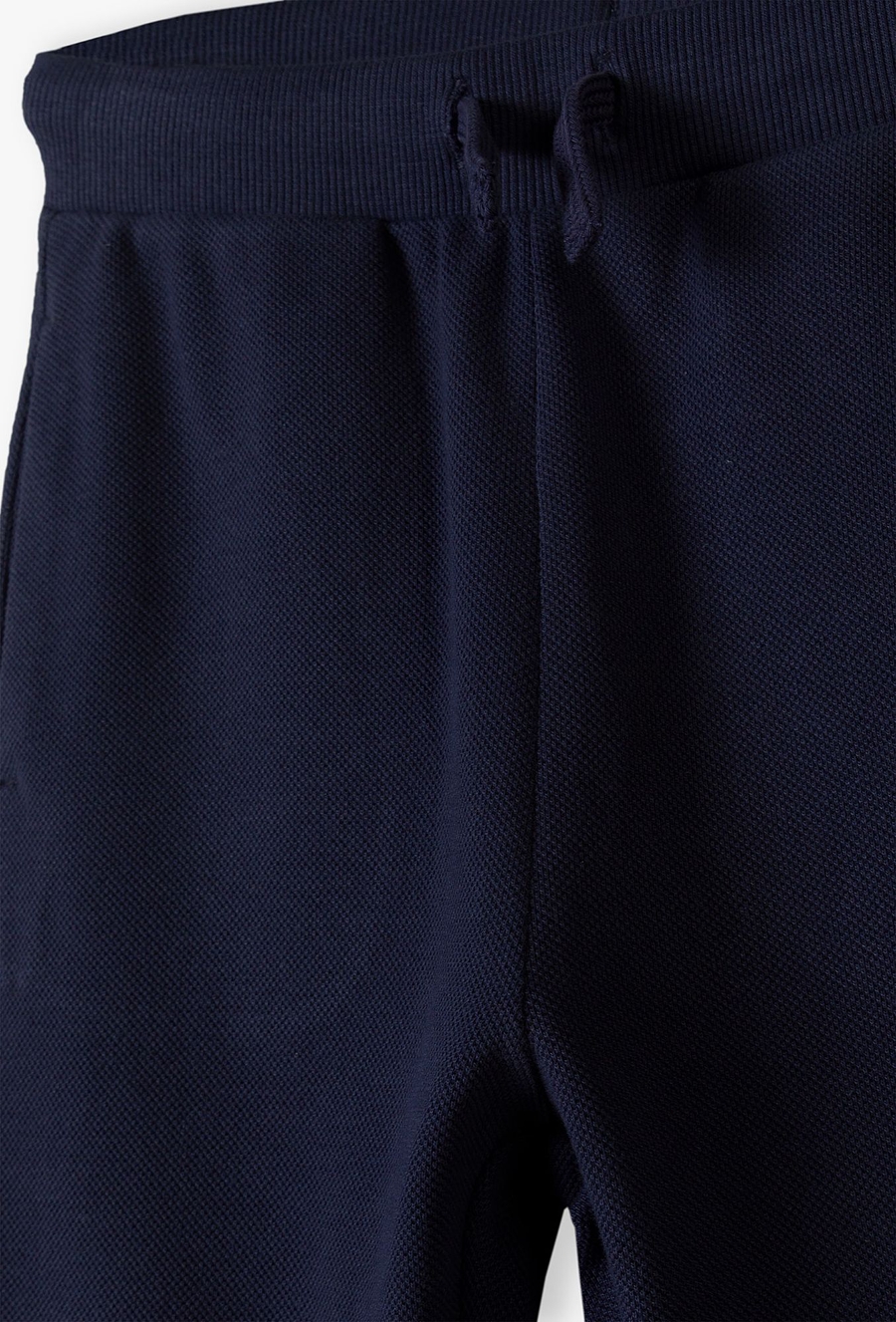Granatowe spodnie dresowe pique dla chłopca - 510.15.