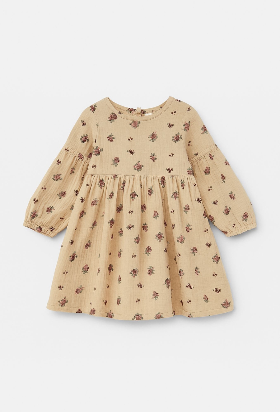 Beżowa sukienka dziewczęca z kwiatowym nadrukiem.