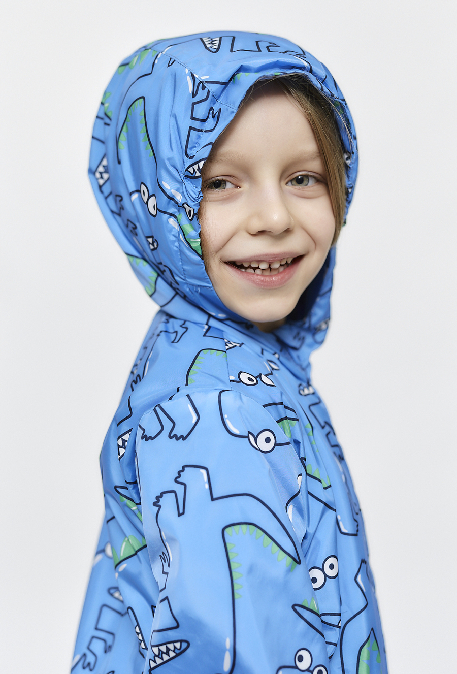 Kurtka chłopięca przejściowa - niebieska w dinozaury