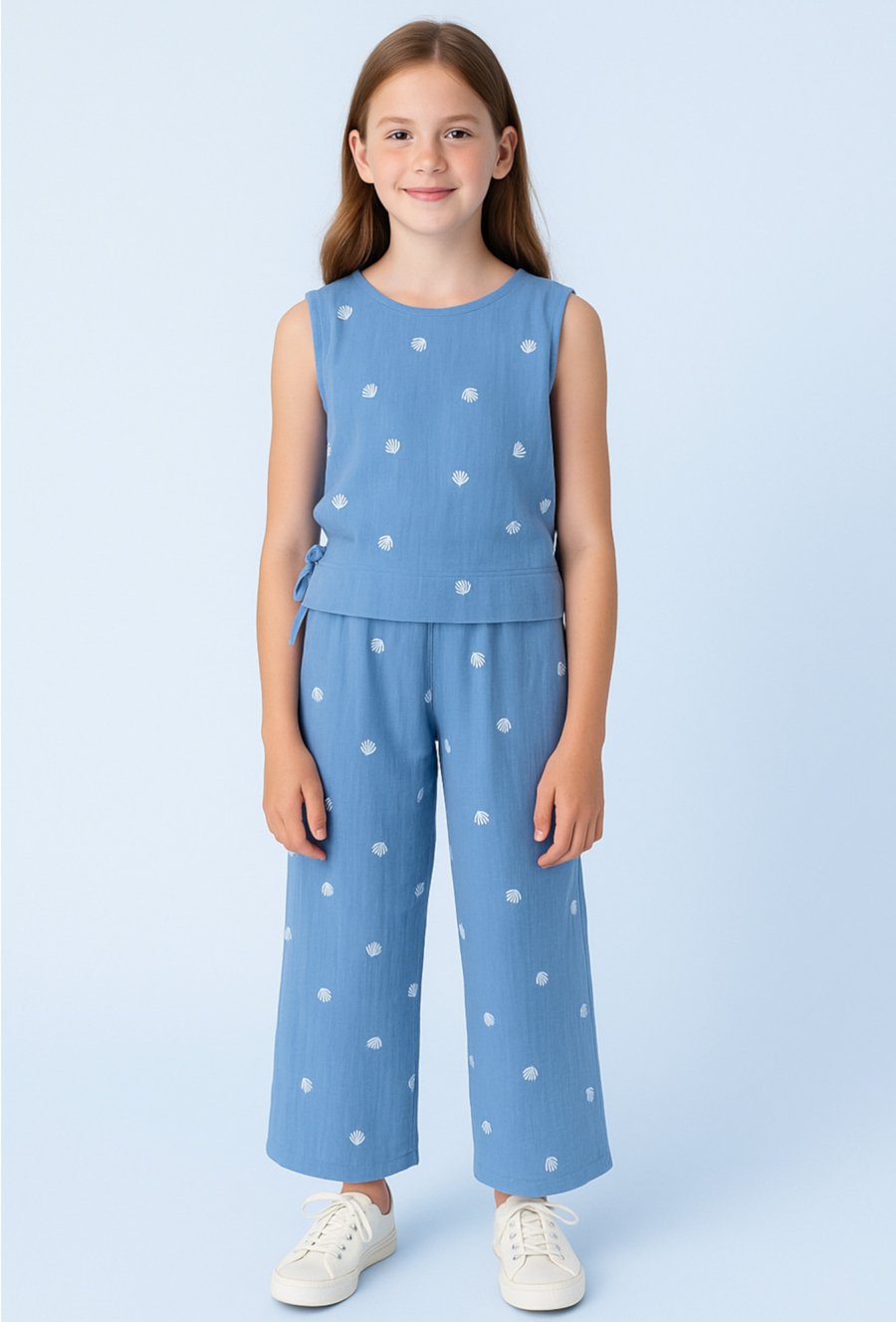 Muślinowa bluzka dziewczęca bez rękawów z - niebieska w muszelki