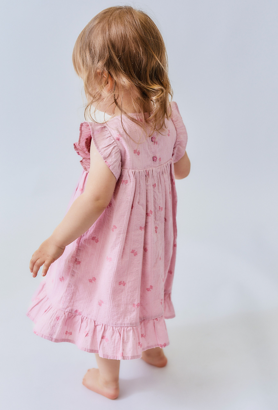 Sukienka niemowlęca z falbankami i kokardkami