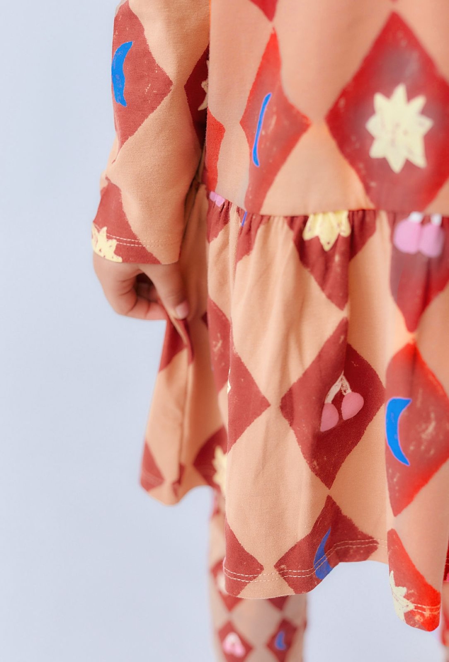 Pomarańczowa sukienka z cyrkowym nadrukiem - Limited Edition