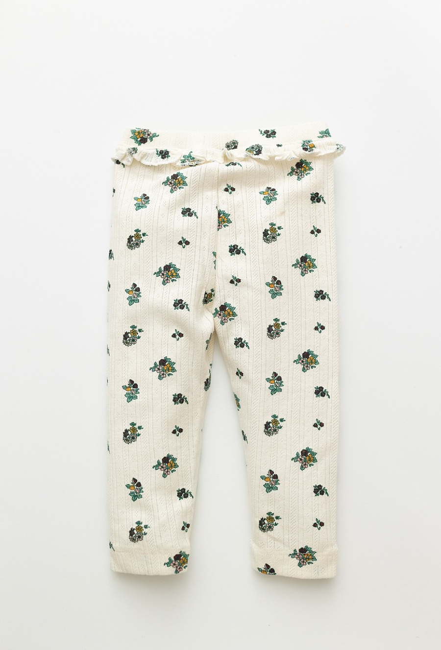 Białe legginsy niemowlęce w kwiatuszki z materiału pointelle