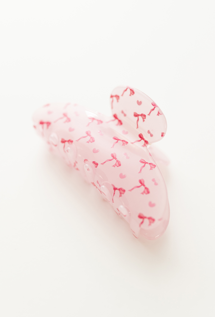Różowa spinka do włosów z nadrukiem kokardek