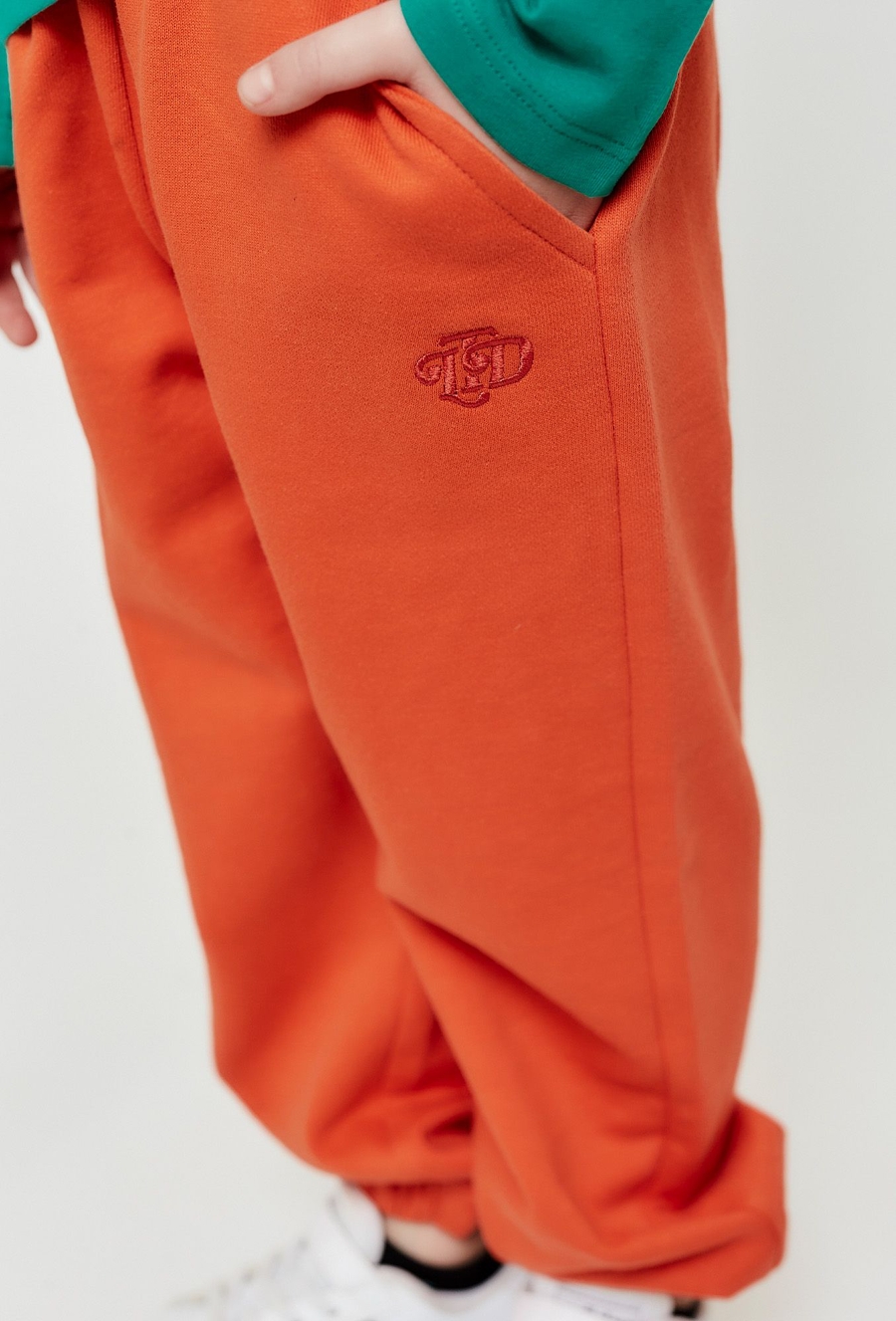 Pomarańczowe spodnie dresowe - unisex - Limited Edition