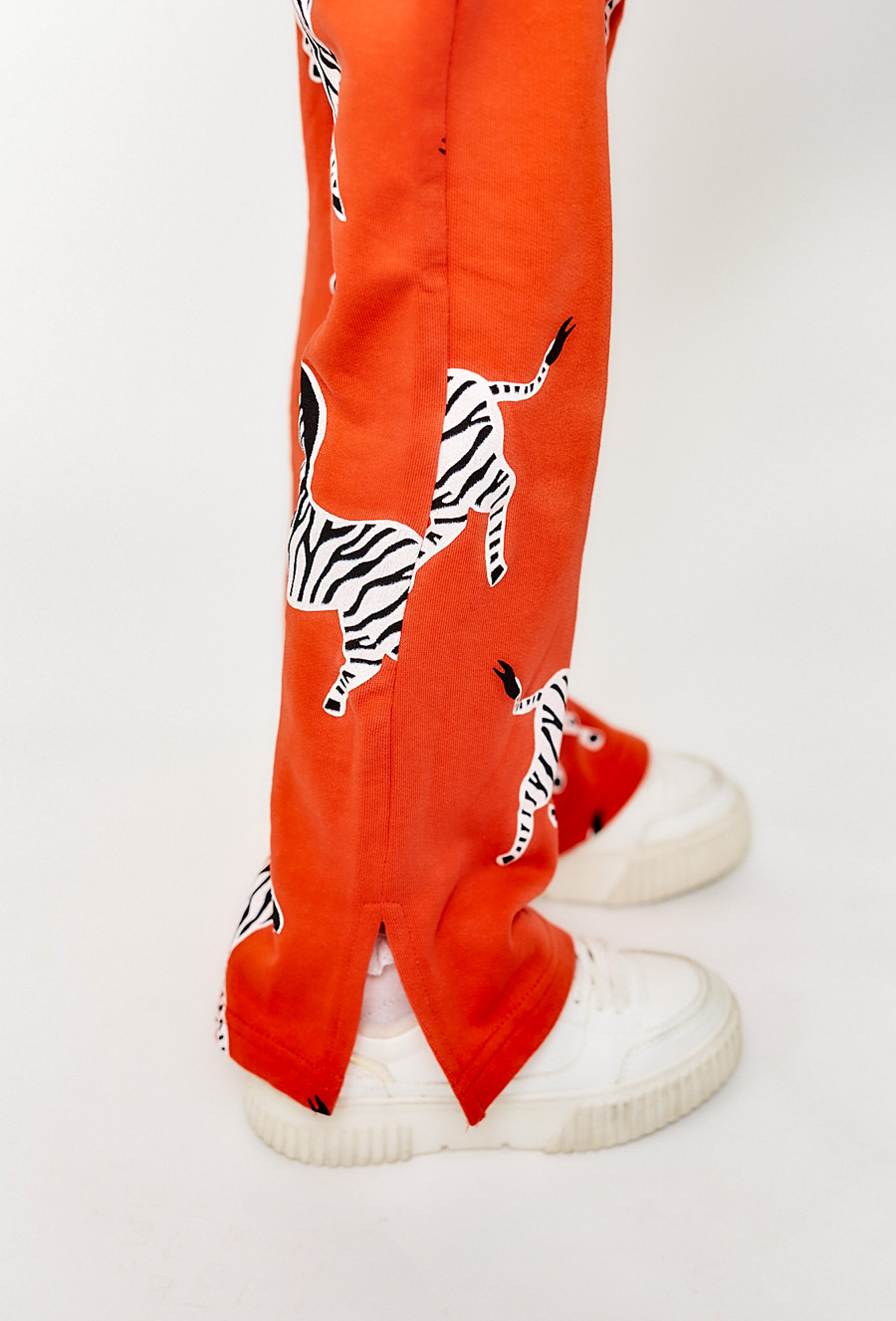 Spodnie dzianinowe dla dziewczynki - flare czerwone w zebry