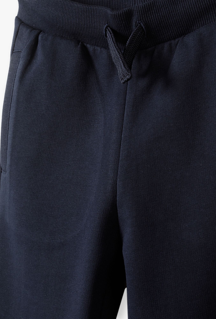 Spodnie dresowe dla chłopca - granatowe -slim