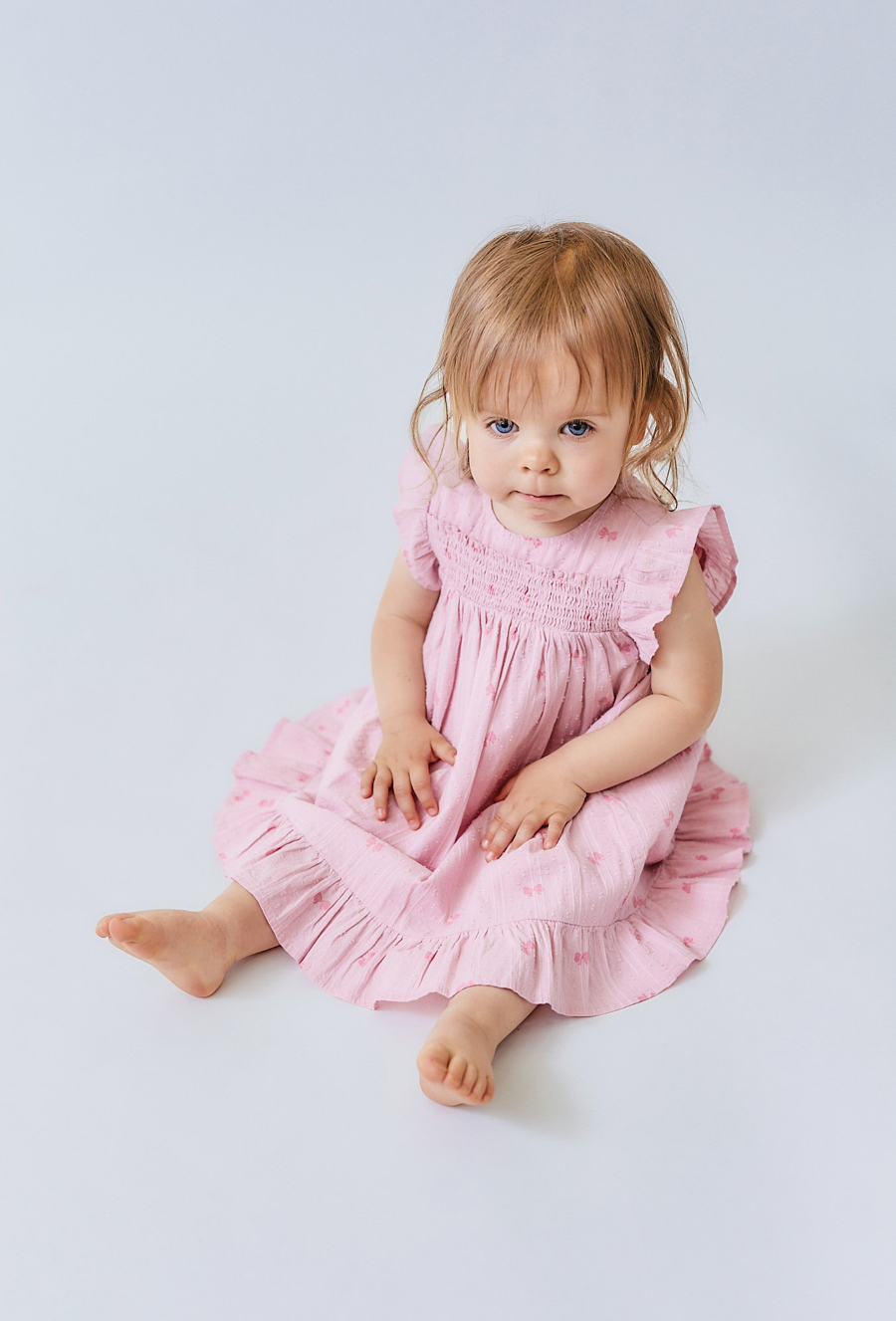 Sukienka niemowlęca z falbankami i kokardkami