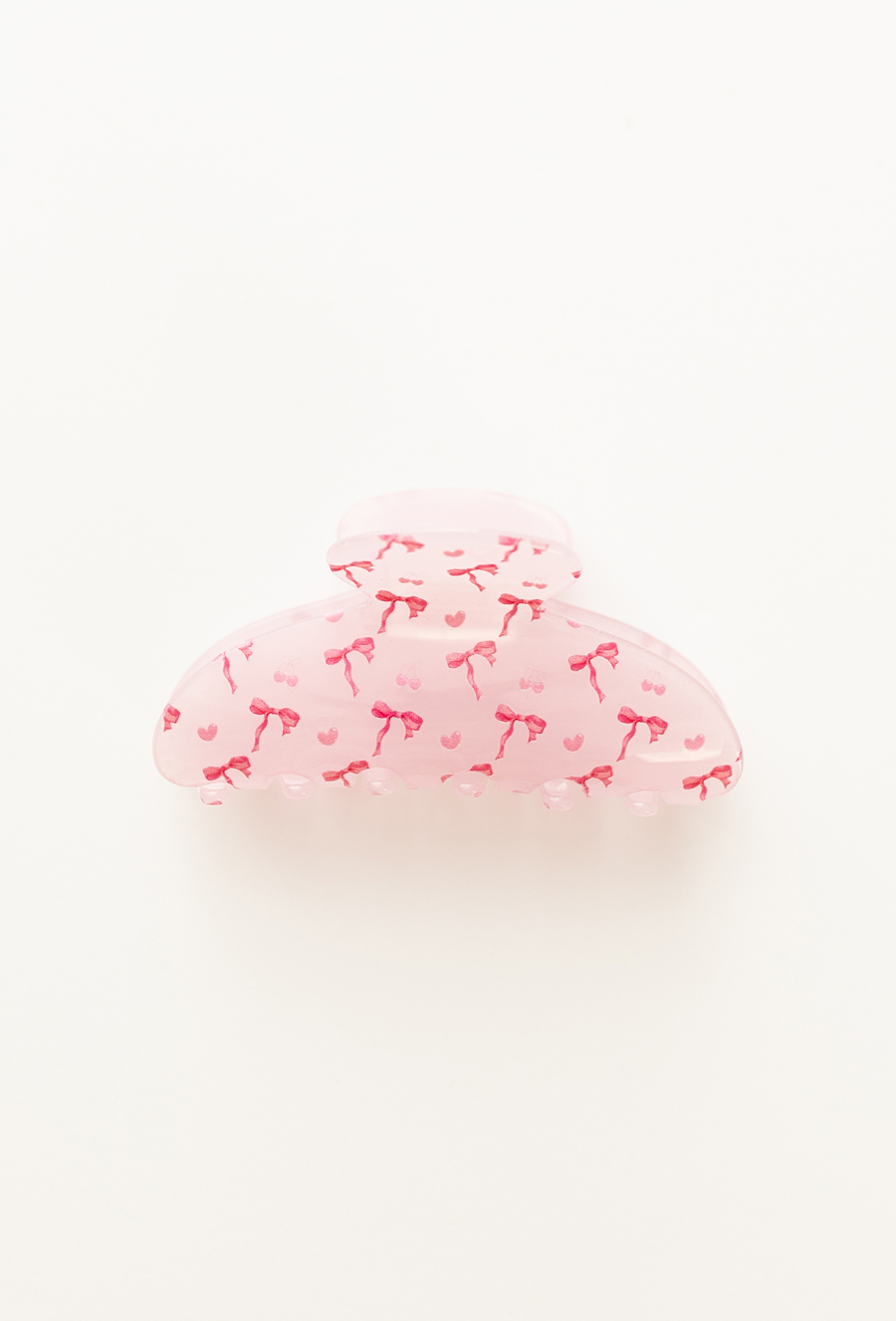 Różowa spinka do włosów z nadrukiem kokardek