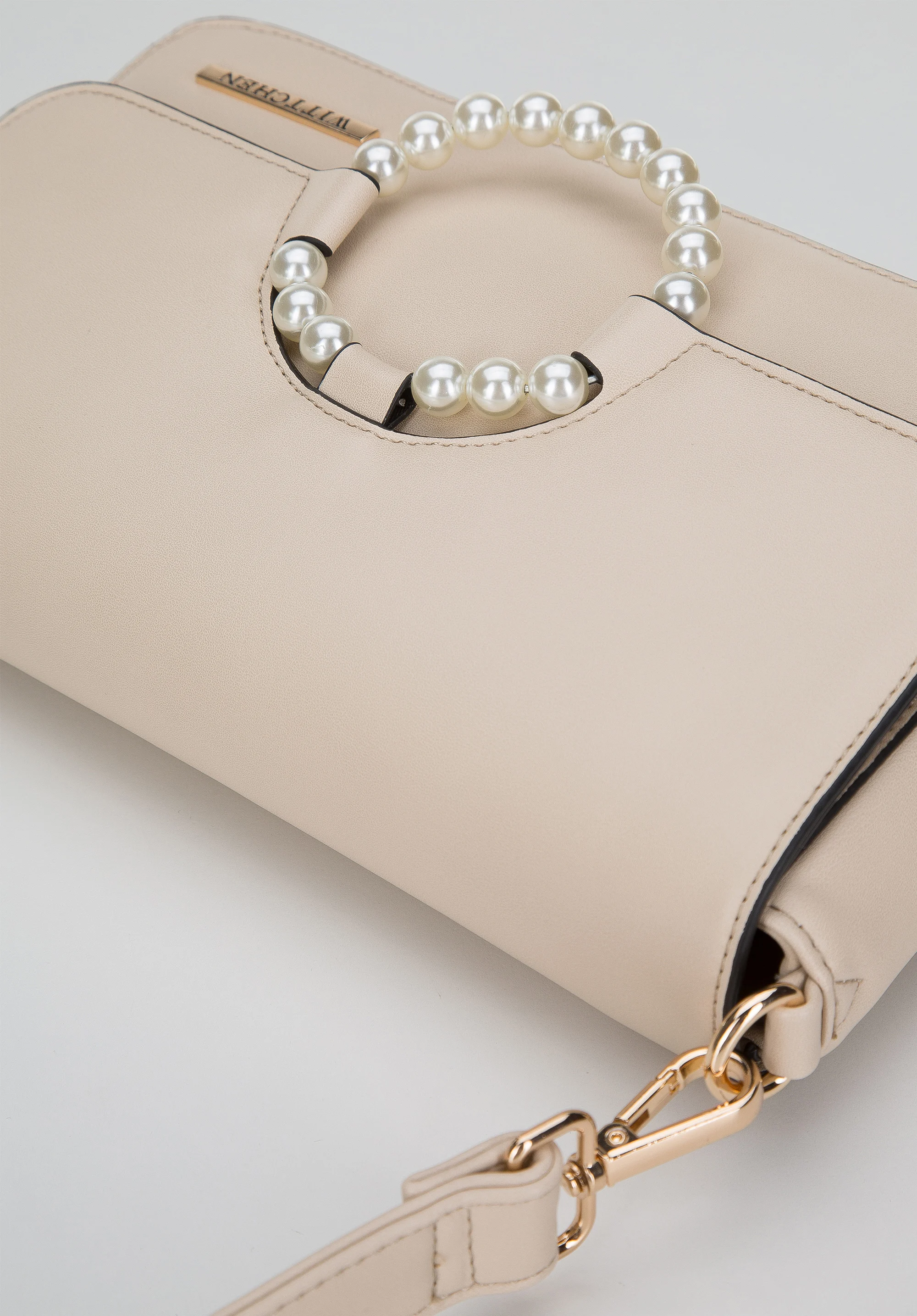 Damska torebka z kółkiem na klapie