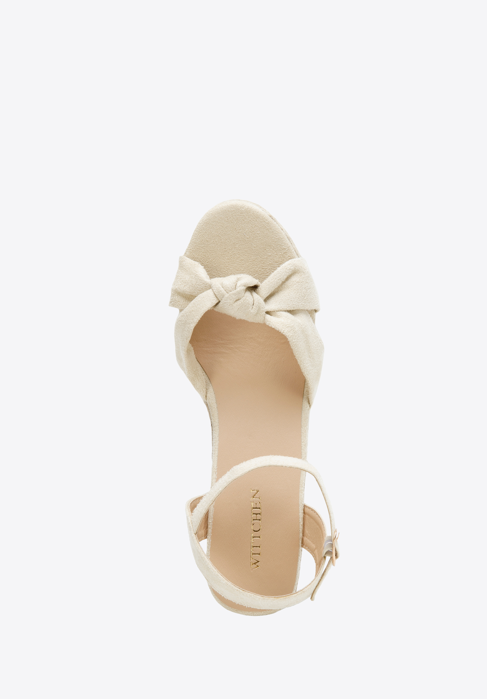 Damskie sandały na koturnie z ozdobnym supełkiem