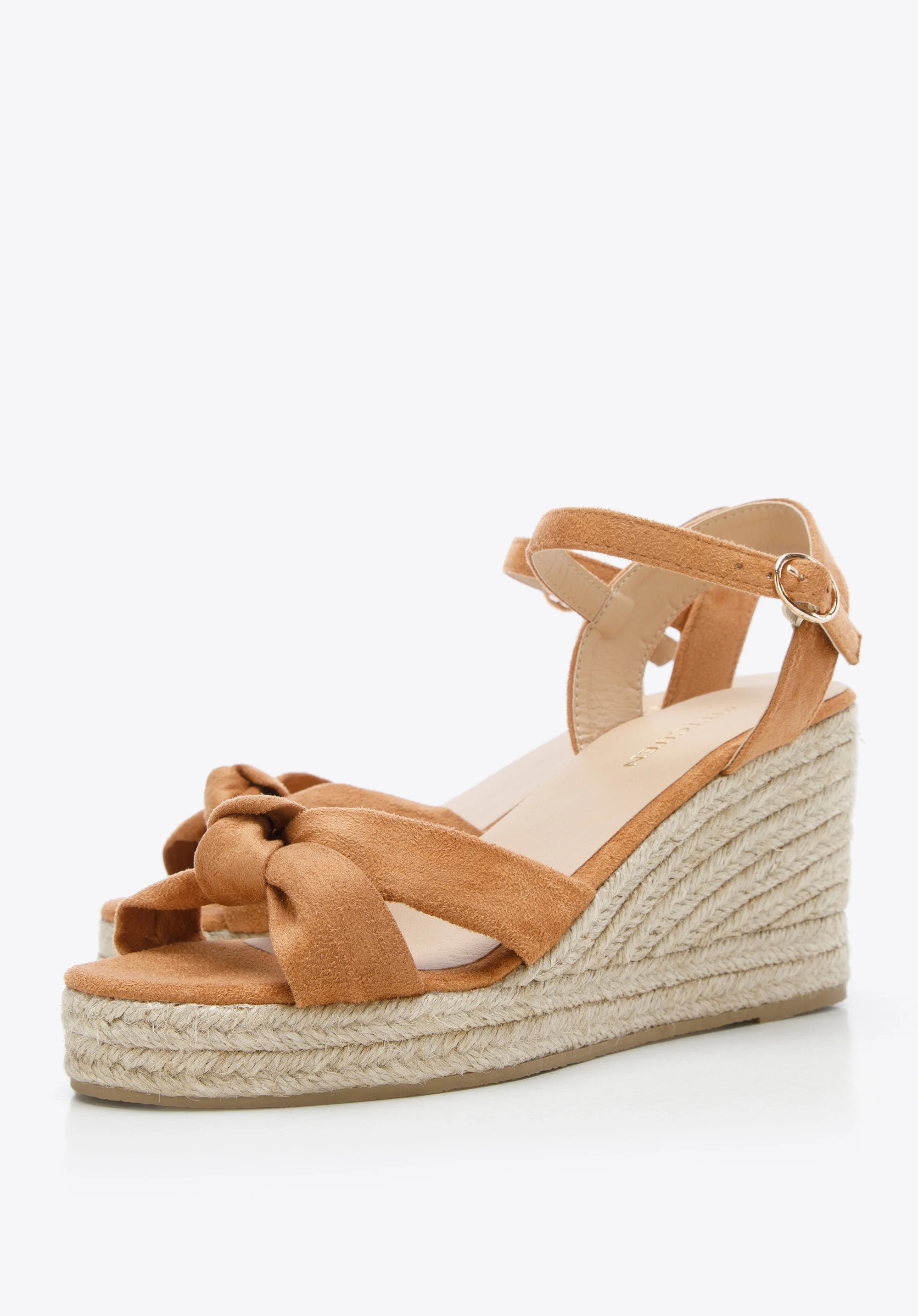 Damskie sandały na koturnie z ozdobnym supełkiem