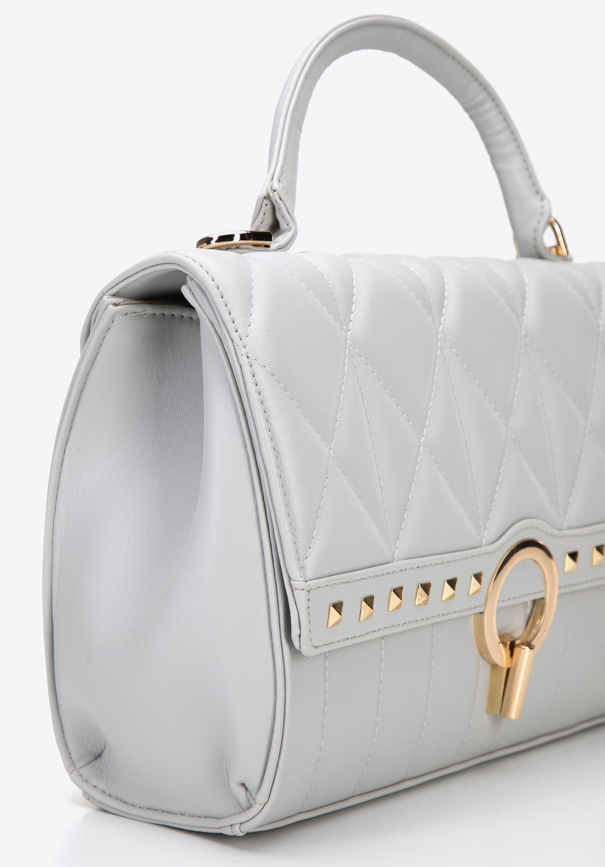 Torebka kuferek z pikowanej ekoskóry z nitami