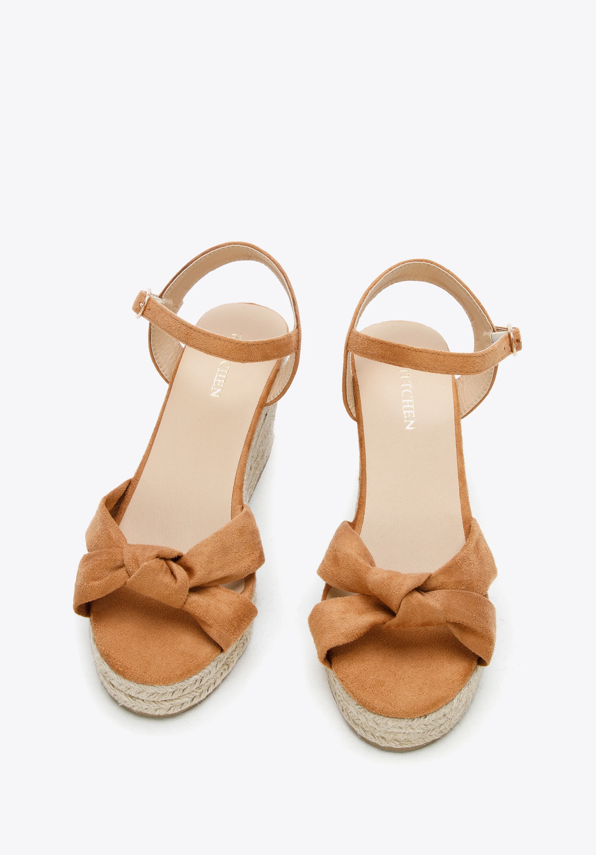 Damskie sandały na koturnie z ozdobnym supełkiem