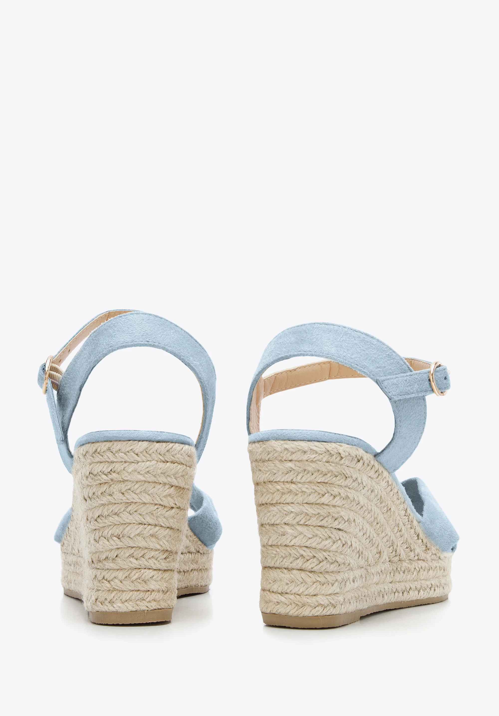 Damskie sandały na koturnie z ozdobnym supełkiem