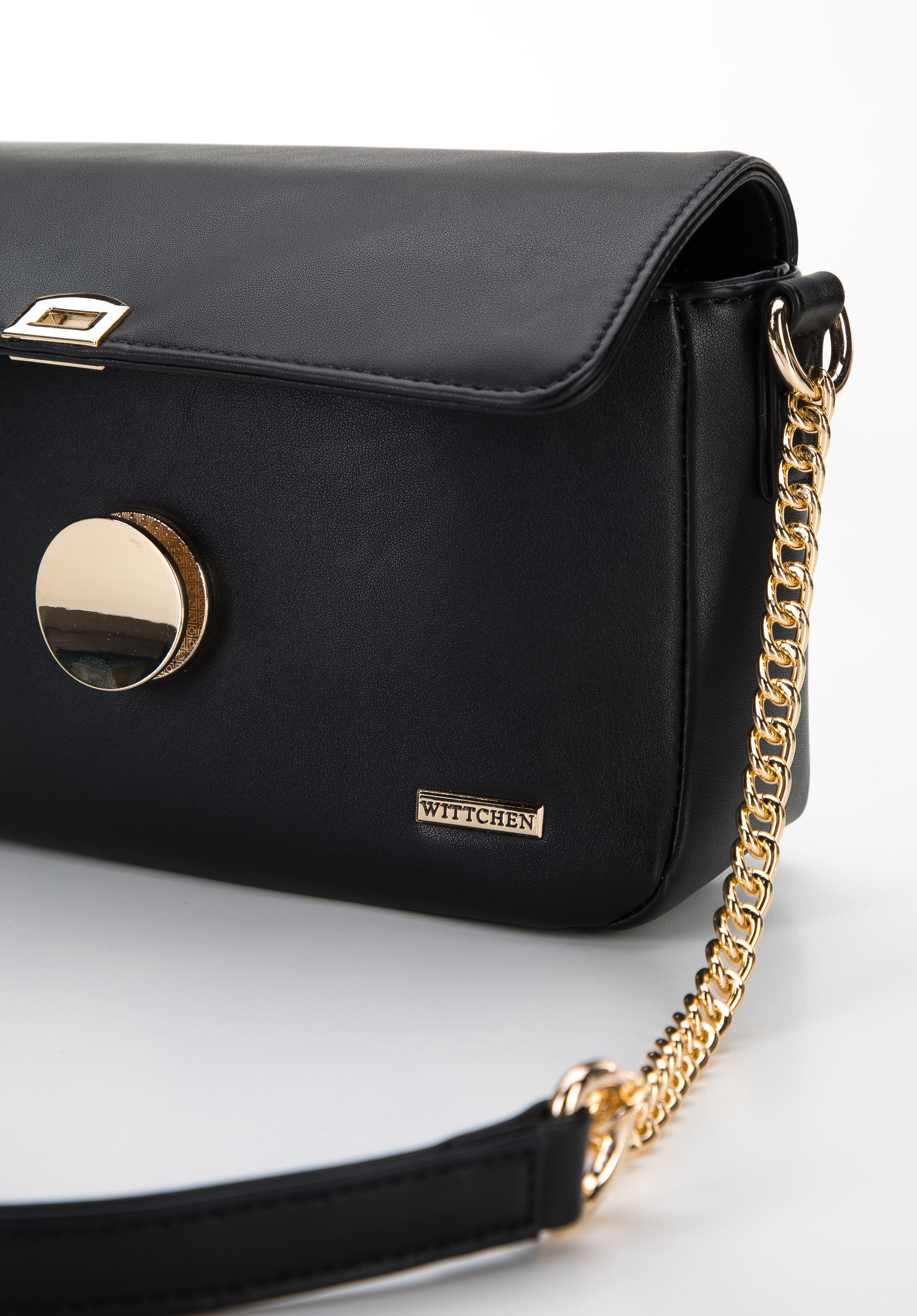 Damska listonoszka z ekoskóry z okrągłą klamrą