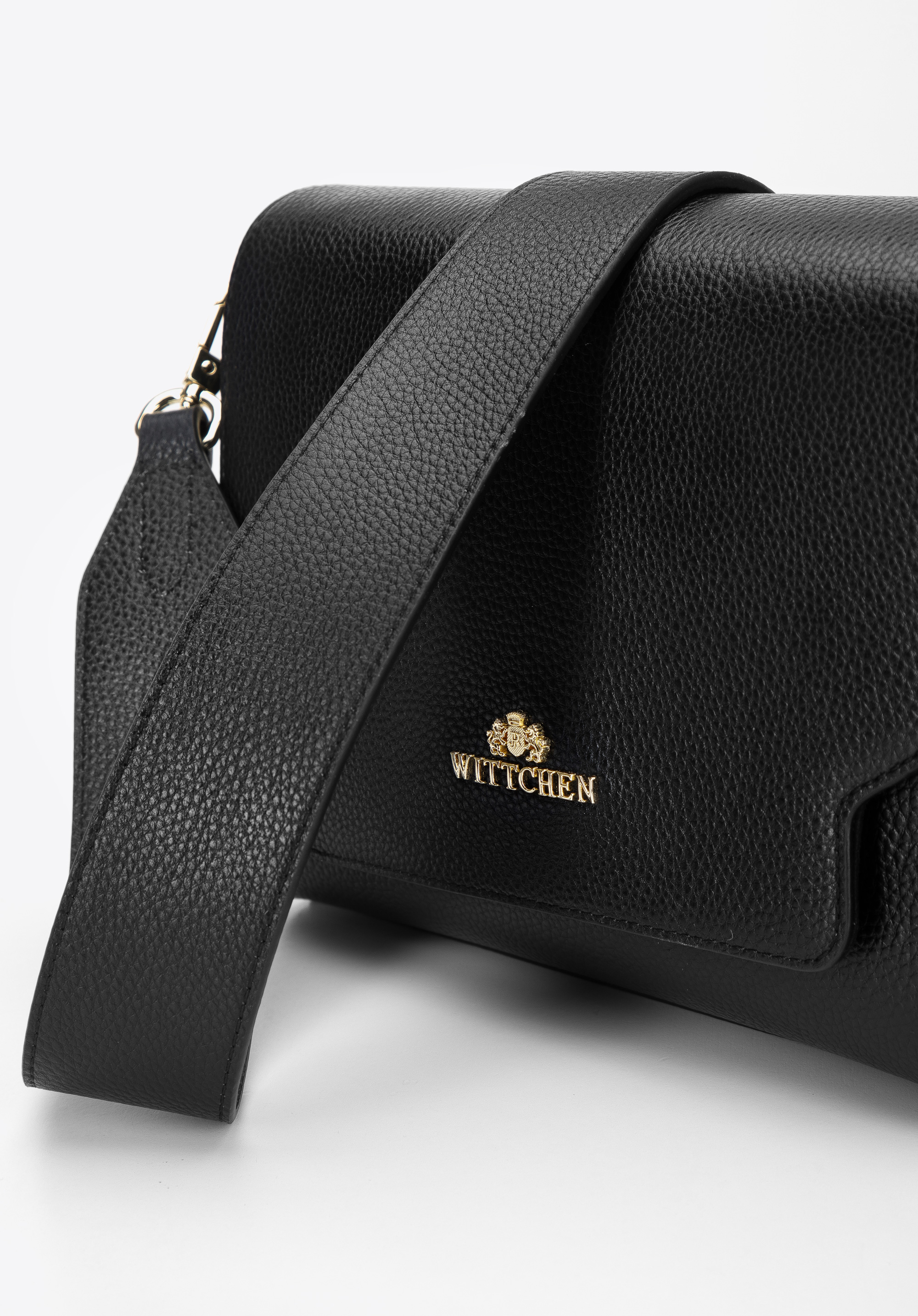 Damska torebka skórzana z klapą o nieregularnym kształcie