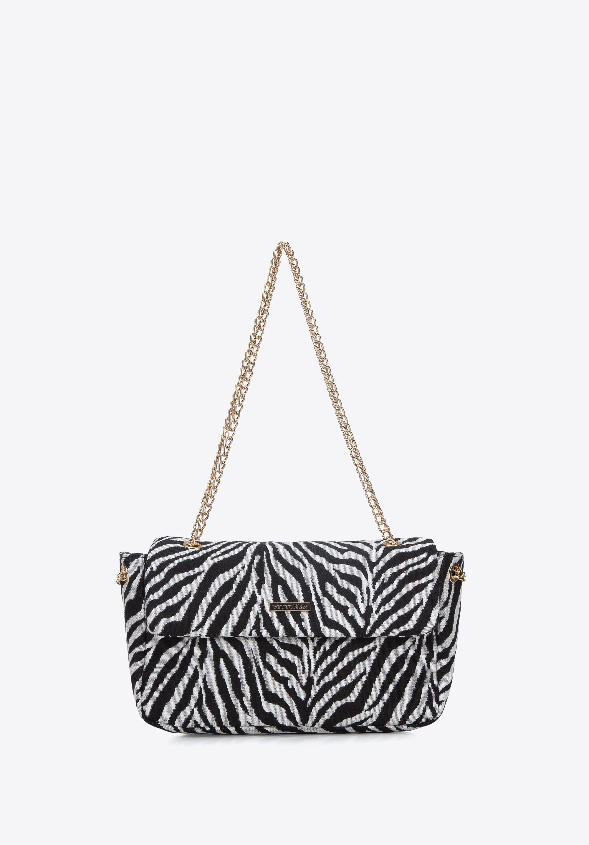 Damska torebka w zebrę na łańcuszku