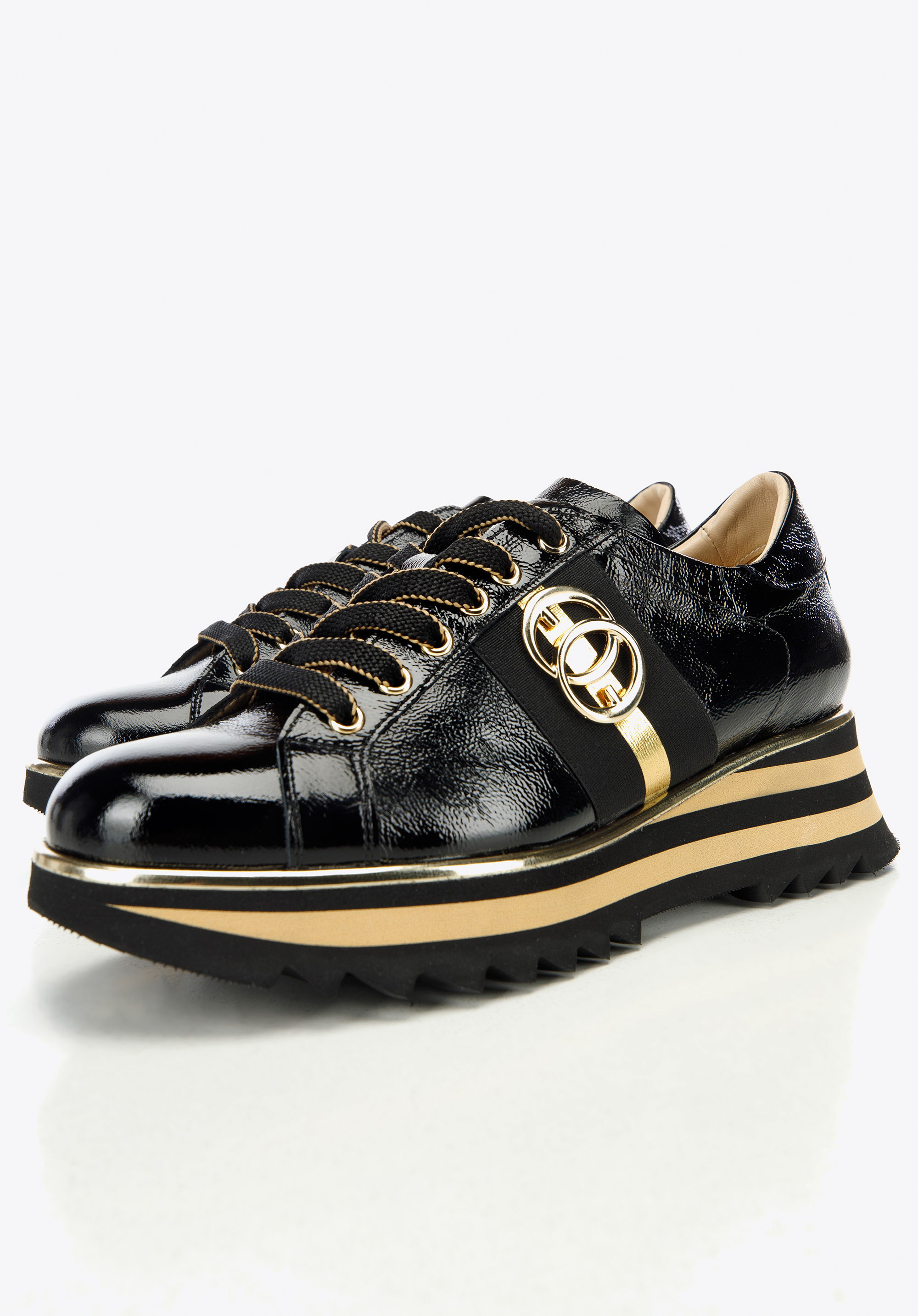 Damskie sneakersy z lakierowanej skóry z klamrą