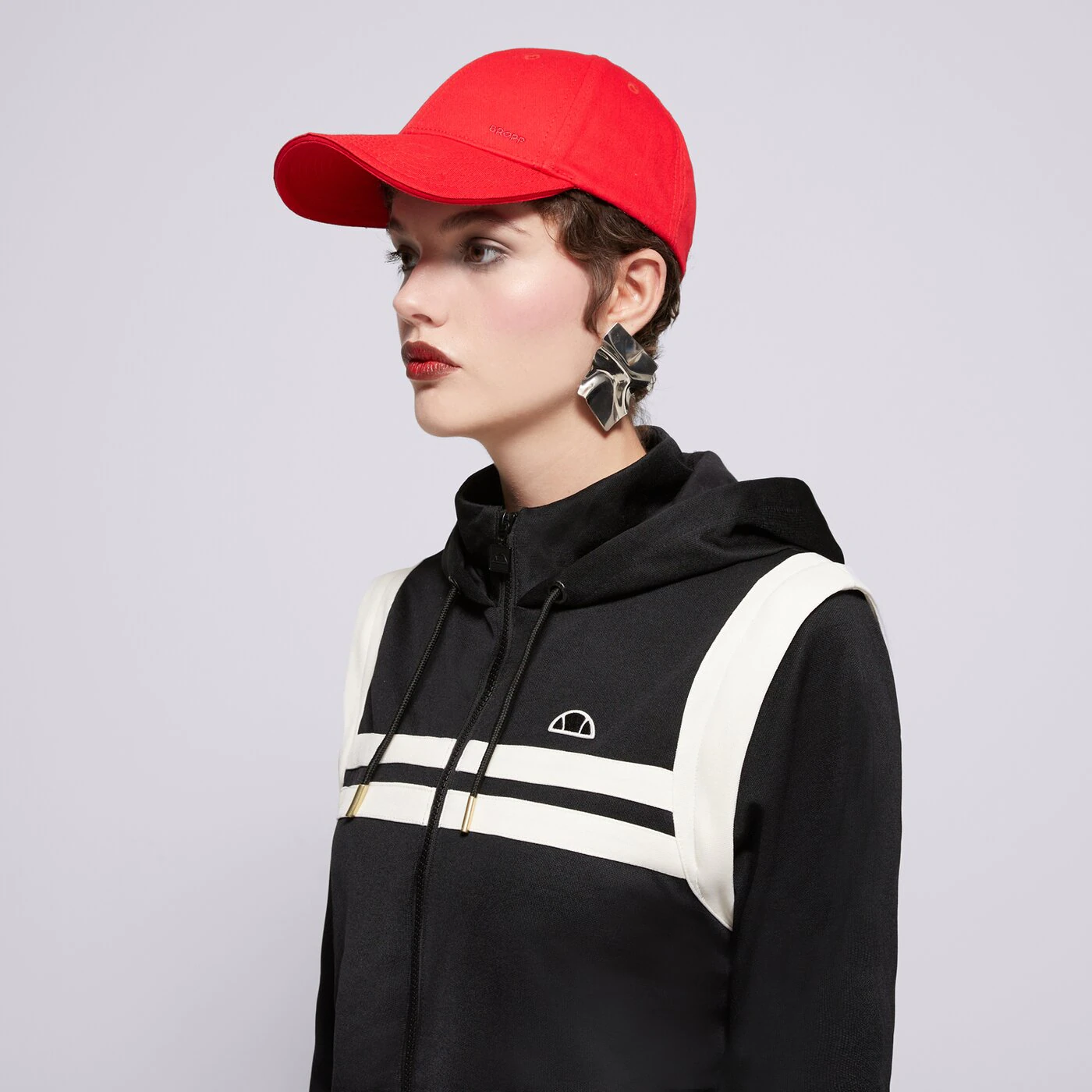 ELLESSE PULÓVER CIPZÁRAS KAPUCNIS PERNA BLK/OWHT CROPPED TRA