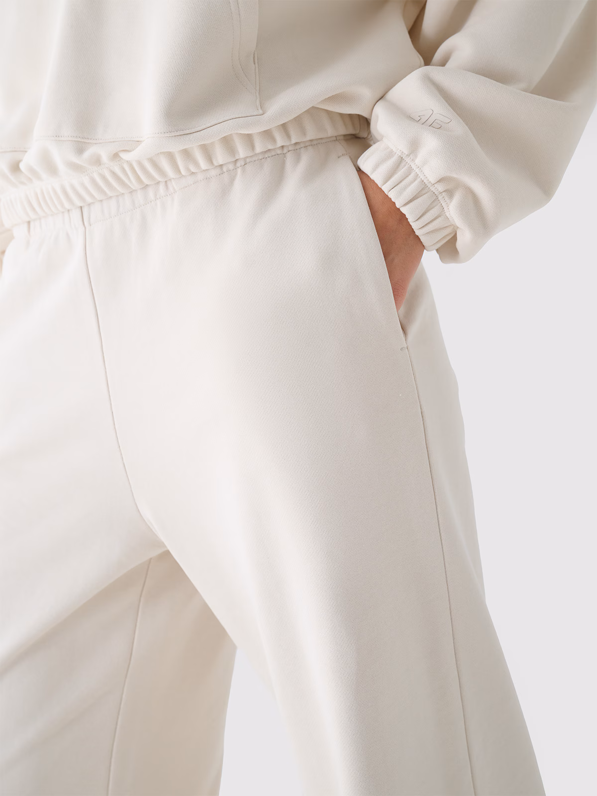 Spodnie dresowe z szerokimi nogawkami damskie - beżowe